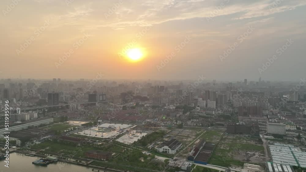 Drone aerial view of Buildings and city in the beautiful sunset. Sunset glow and the downtown city of Shanghai China, cityscape of asian city. Business, travel and life style concept b-roll footage. Drone aerial view of Buildings and city in the beautiful sunset. Sunset glow and the downtown city of Shanghai China, cityscape of asian city. Business, travel and life style concept b-roll footage.