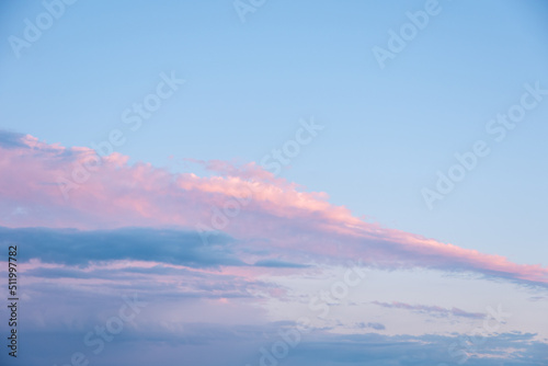 Abstract pink sunset sky background with motion blur. Bright pink-blue sky background. Natural sky background to replace the sky in your photos.