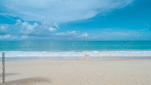 softwave and sand on beach and blue summer sky. Panoramic beach landscape. Empty tropical beach and seascape. Orange and golden sunset sky, soft sand, calmness, tranquil relaxing sunlight, summer mood