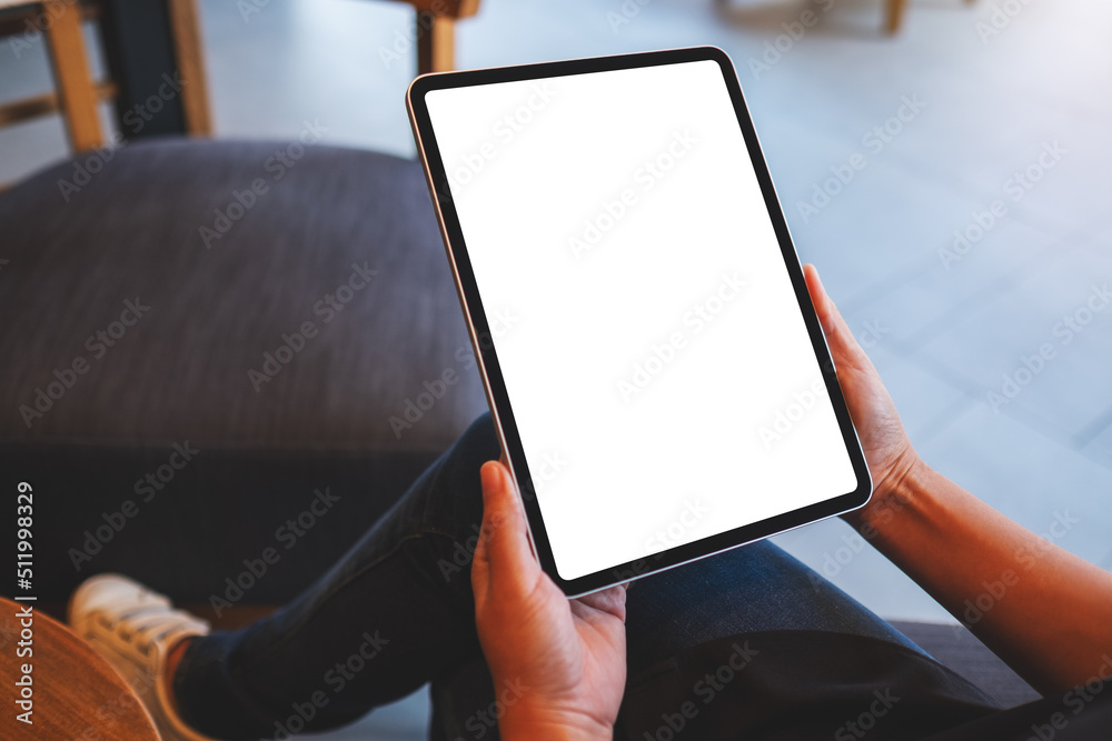 Mockup image of a woman holding digital tablet with blank white desktop screen Mockup image of a woman holding digital tablet with blank white desktop screen