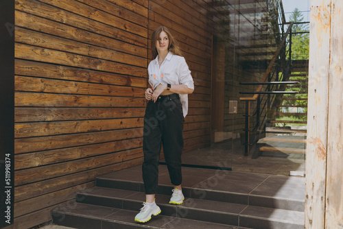 A girl in a white shirt walks down the steps