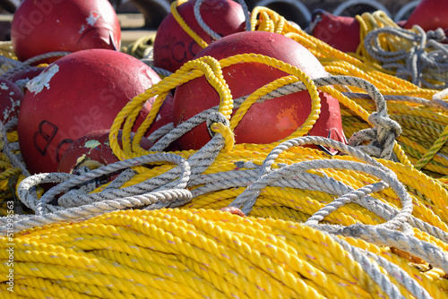 Colorful fishing lobster and crab baskets with blue and orange nets