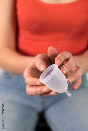 Transparent silicone bowl in the hands of a girl influencer who recommends her.