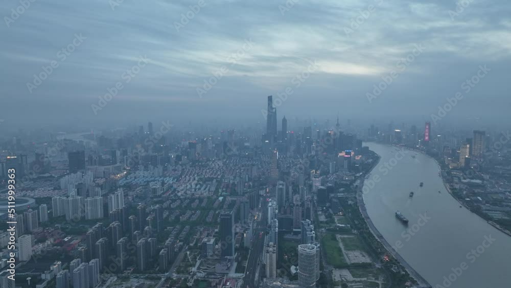 Drone aerial view of Epic cityscape of downtown in the sunset. Tons of buildings and skyscrapers in city around the river in Shanghai China. Business, travel and life style concept b-roll footage. Drone aerial view of Epic cityscape of downtown in the sunset. Tons of buildings and skyscrapers in city around the river in Shanghai China. Business, travel and life style concept b-roll footage.