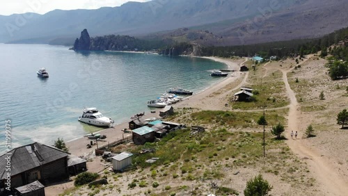 Beautiful view of Cape Kolokolny , Sandy bay. A famous place on Lake Baikal with walking trees and a sandy beach on a summer day.
 photo