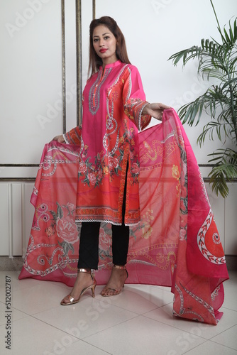 A Pakistani  Model showing her dress with style, 

A Pakistani Model Wearing Eastern Dress photo