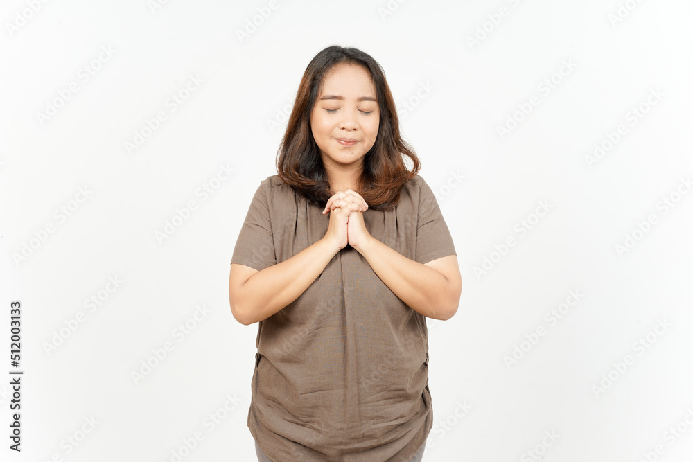Fold hand praying gesture of Beautiful Asian Woman Isolated On White Background Fold hand praying gesture of Beautiful Asian Woman Isolated On White Background