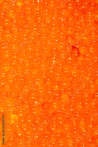 Red caviar as an abstract background.