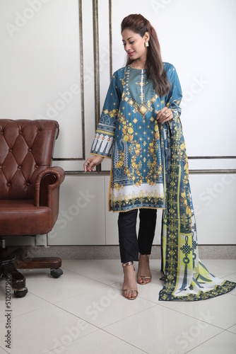 A Pakistani  Model showing her dress with style, 

A Pakistani Model Wearing Eastern Dress photo