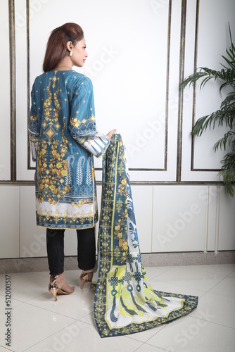 A Pakistani  Model showing her dress with style, 

A Pakistani Model Wearing Eastern Dress photo