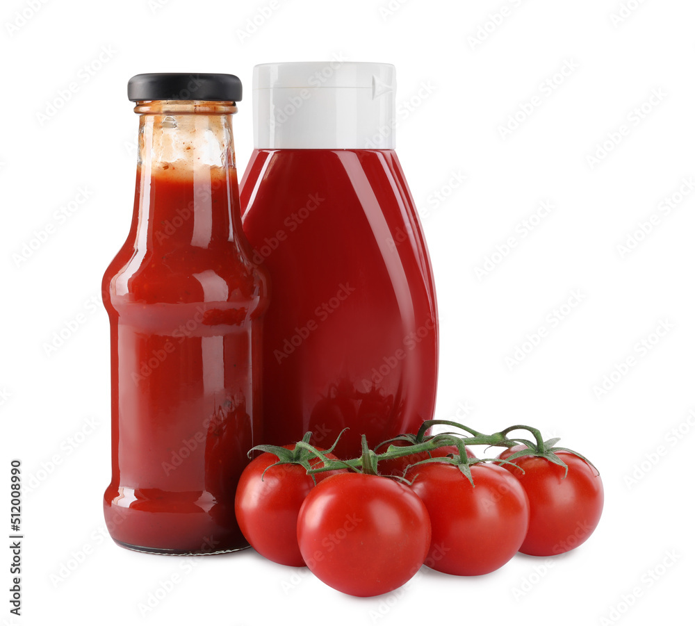 Different bottles of tasty ketchup and fresh tomatoes isolated on white