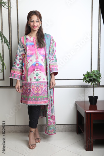 A Pakistani  Model showing her dress with style, 

A Pakistani Model Wearing Eastern Dress photo