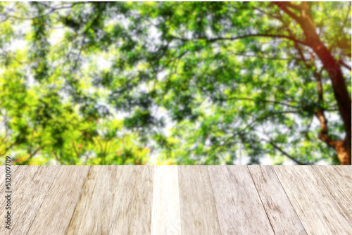 brown wood perspective plank with green leaves nature background