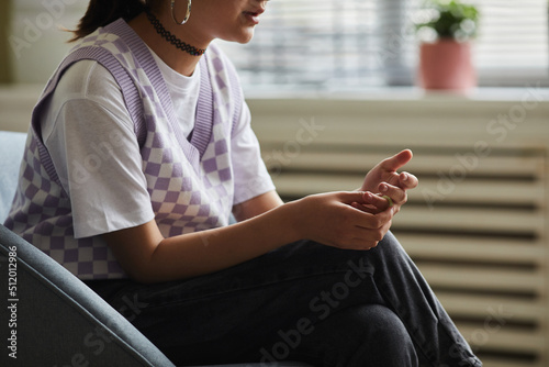 Εκτύπωση καμβά Close-up of teenage girl sitting on armchair and talking during psychotherapy se