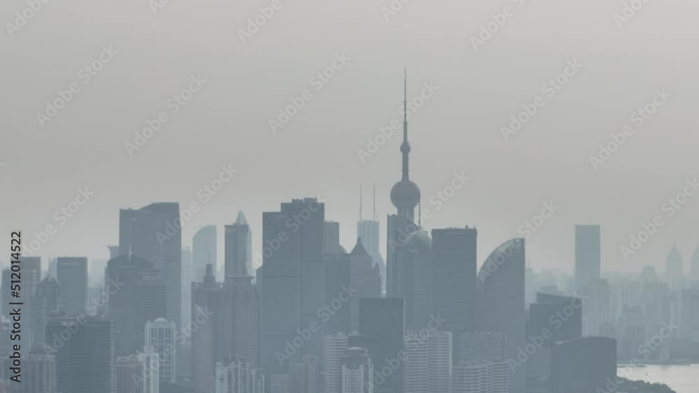Drone aerial view of City skyline in the heavy fog in cloudy day. Long distance shot of skyline in Lujiazui downtown district in Shanghai China. Business, travel and economy concept b-roll footage. Drone aerial view of City skyline in the heavy fog in cloudy day. Long distance shot of skyline in Lujiazui downtown district in Shanghai China. Business, travel and economy concept b-roll footage.