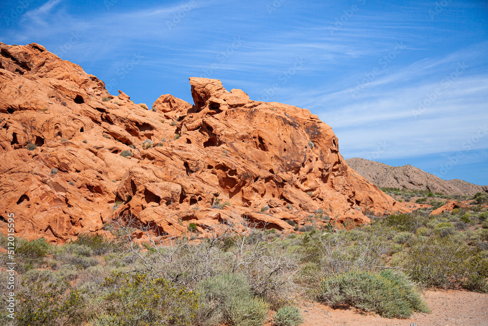Fototapeta premium Red sandstone eroded with a road winding through the national park in America