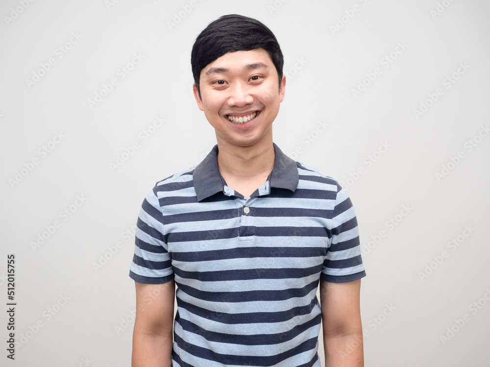 Asian positive man striped shirt gentle smile isolated Asian positive man striped shirt gentle smile isolated
