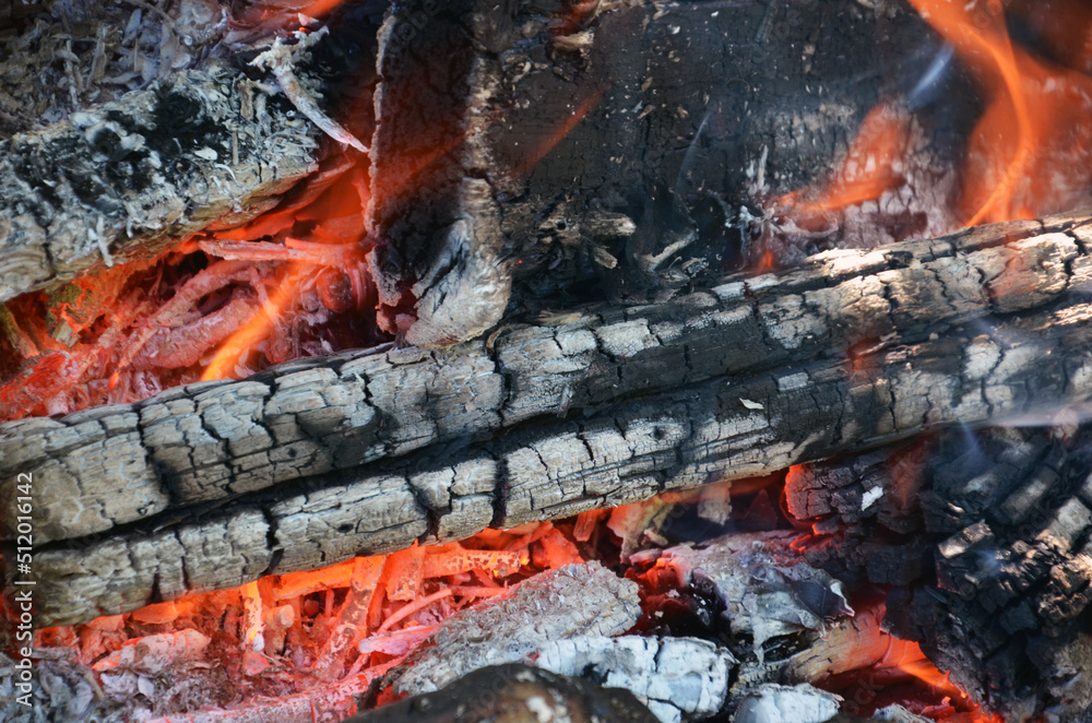 Burning firewood close up. Firewood burning on the grill. bonfire close up Burning firewood close up. Firewood burning on the grill. bonfire close up