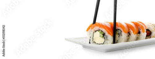 Plate with tasty sushi rolls on white background with space for text