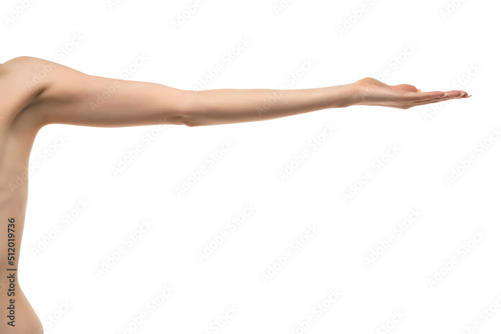 Young woman's stretched skinny arm and open palm holding imaginary product. Isolated on white background.