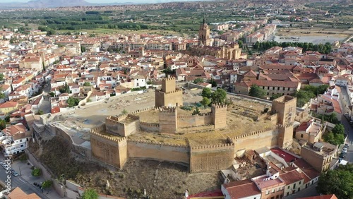 Aerial view of Guadix cityscape overlooking medieval Moorish fortified alcazaba in foreground and Roman Catholic Cathedral in background, Granada, Spain. High quality 4k footage photo