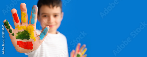 Little boy with hand in pai...