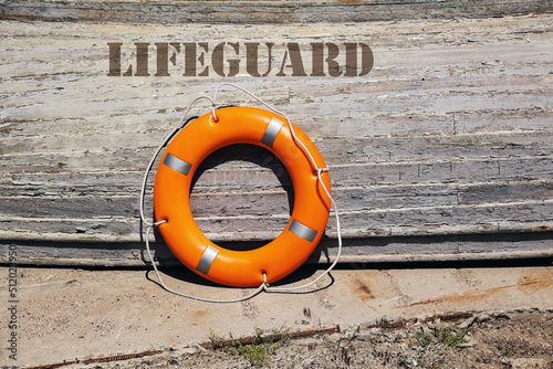 Boat with lifebuoy ring on berth photo