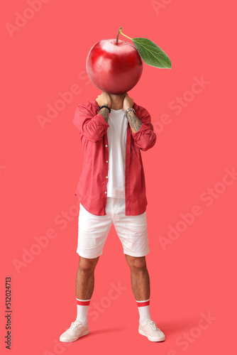 Tattooed man with ripe plum...
