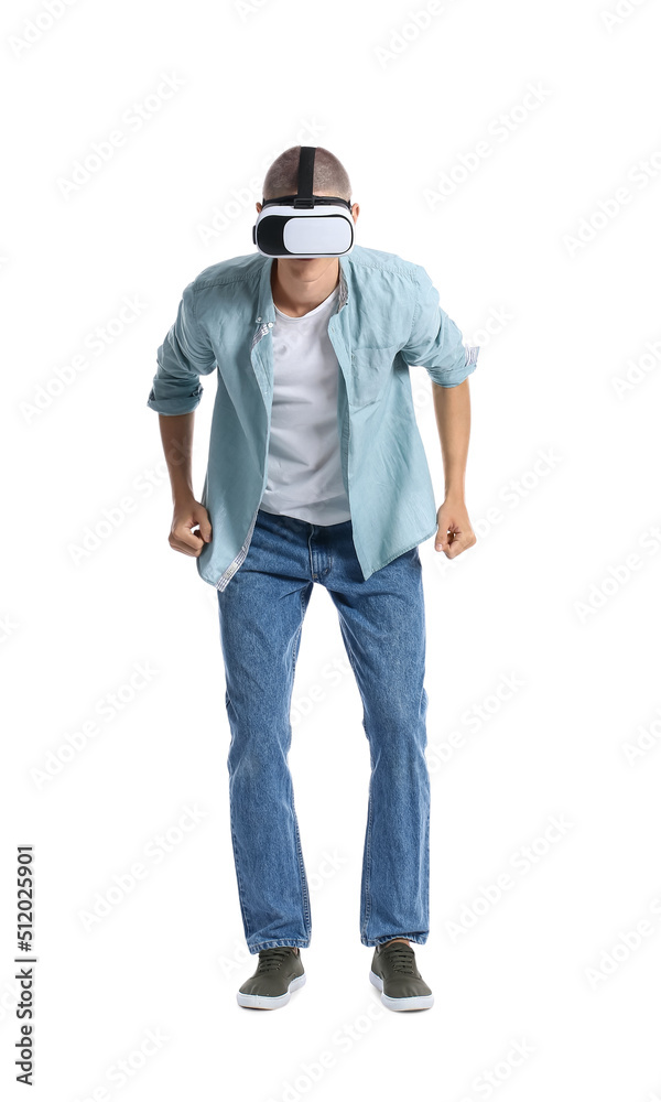 Young guy in VR glasses on white background Young guy in VR glasses on white background