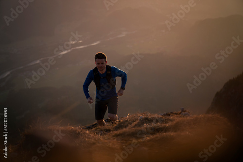 Hiker moving up on mountain photo
