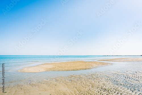 View of the Adriatic Sea from the sandy beach in Pesaro  Italy  during a sunny spring day