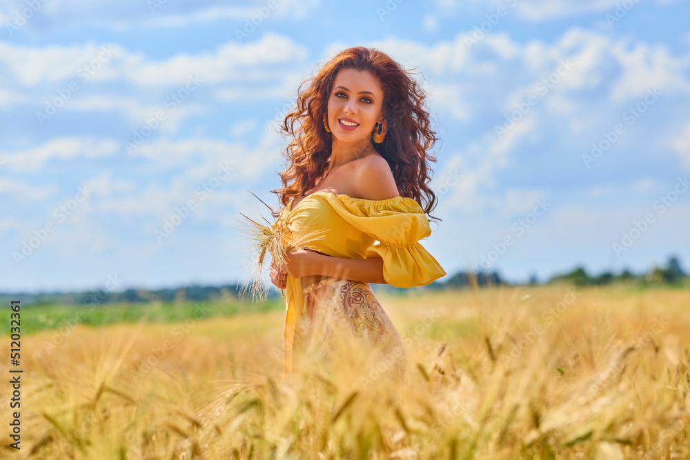 A happy caucasian young and beautiful woman in a field. A happy caucasian young and beautiful woman in a field.