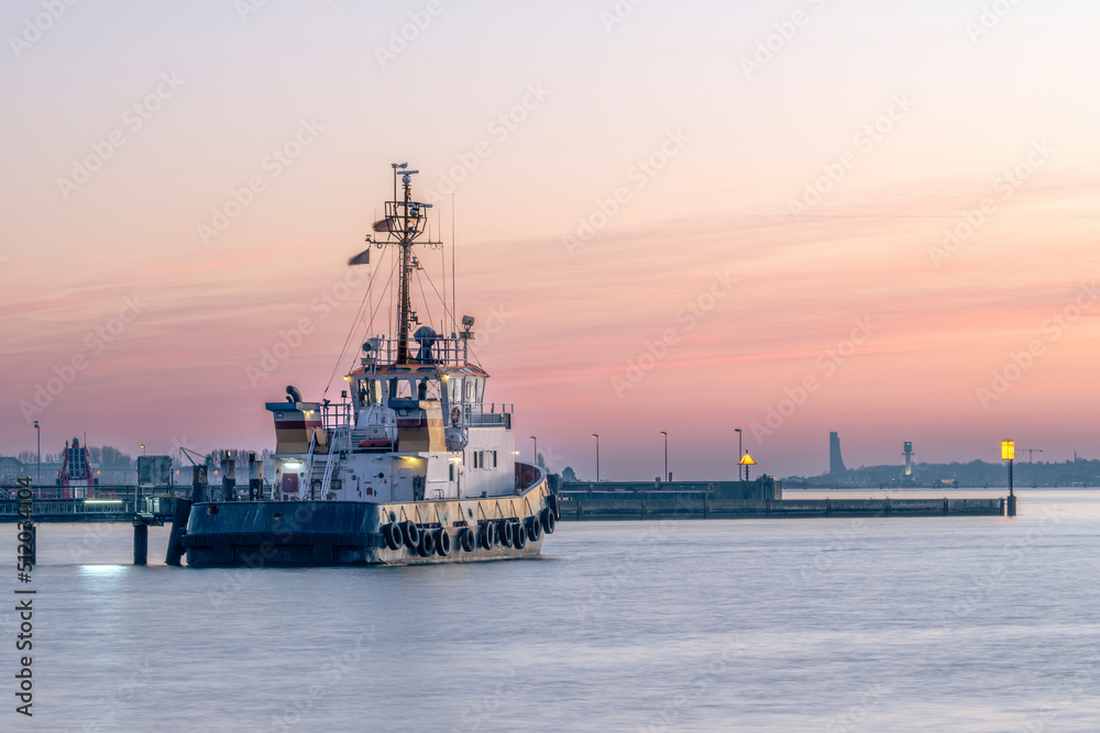 Germany, Schleswig-Holstein, Kiel, Ship moored in Holtenau harbor at dusk Germany, Schleswig-Holstein, Kiel, Ship moored in Holtenau harbor at dusk