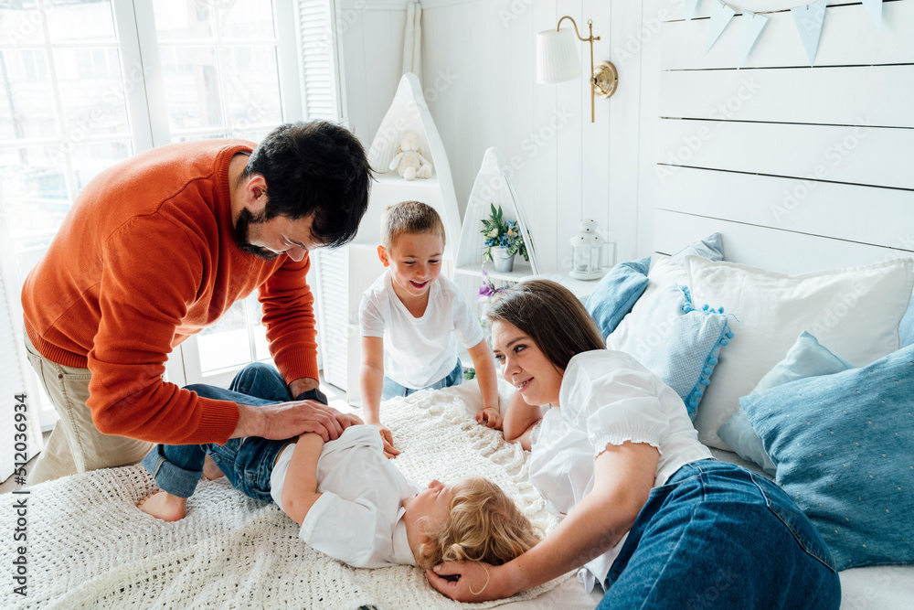 Happy family having fun together at home Happy family having fun together at home