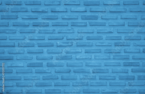 Brick wall painted with pale blue dark paint pastel calm tone texture background. Brickwork and stonework flooring interior rock old pattern.