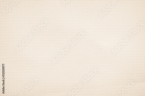 Fabric canvas woven texture background in pattern in light beige cream brown. Natural gauze linen, carpet wool and cotton cloth textile as sack material.