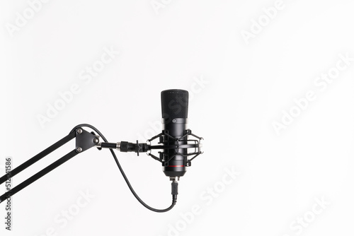 A close up image of proffesional studio microphone isolated on the white background