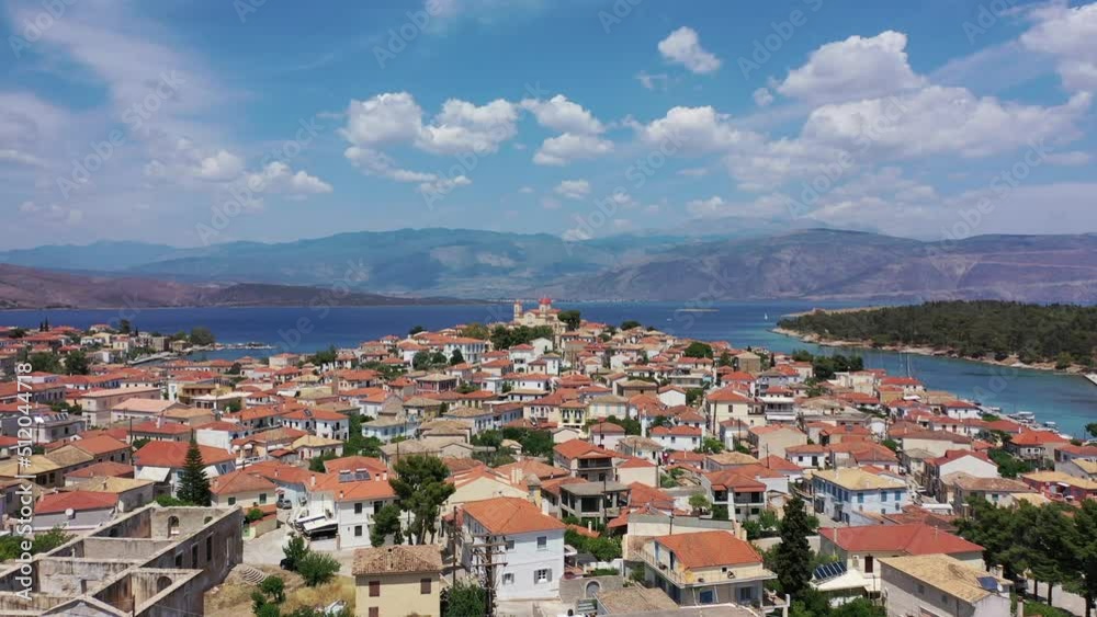Aerial drone video from picturesque and traditional historic village of Galaxidi featuring landmark church of Agios Nikolaos, Fokida, Greece Aerial drone video from picturesque and traditional historic village of Galaxidi featuring landmark church of Agios Nikolaos, Fokida, Greece