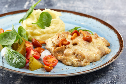 pork with mashed potato and vegetables