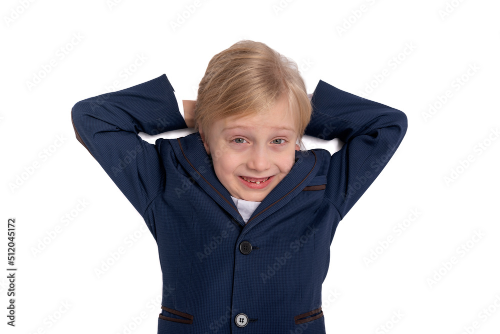 Portrait of boy of 7-8 years old in school uniform in isolation on white background. Child put his hands behind head and looks guilty. Portrait of boy of 7-8 years old in school uniform in isolation on white background. Child put his hands behind head and looks guilty.
