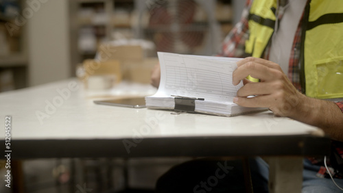 Employee is checking the goods in the warehouse.