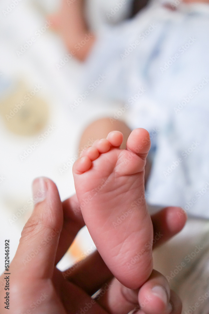 Baby feet in father's hand Baby feet in father's hand