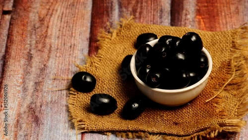pan moov of blackberry or jamun,Close up of fresh Jamun fruits in bowl,blackberry or jamun fruits photo