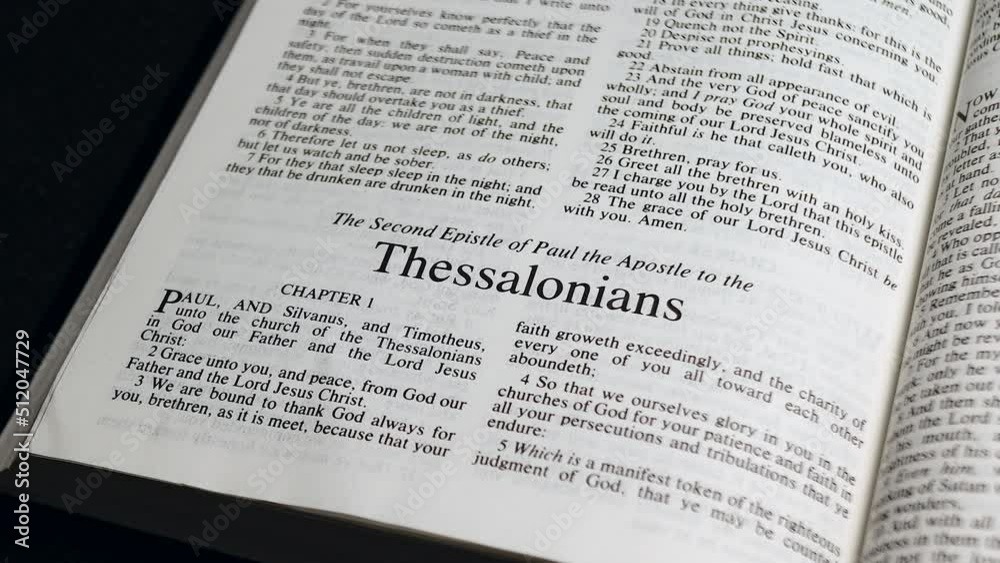 Close Up Shot of Bible Page Turning to the book of Second Thessalonians Close Up Shot of Bible Page Turning to the book of Second Thessalonians