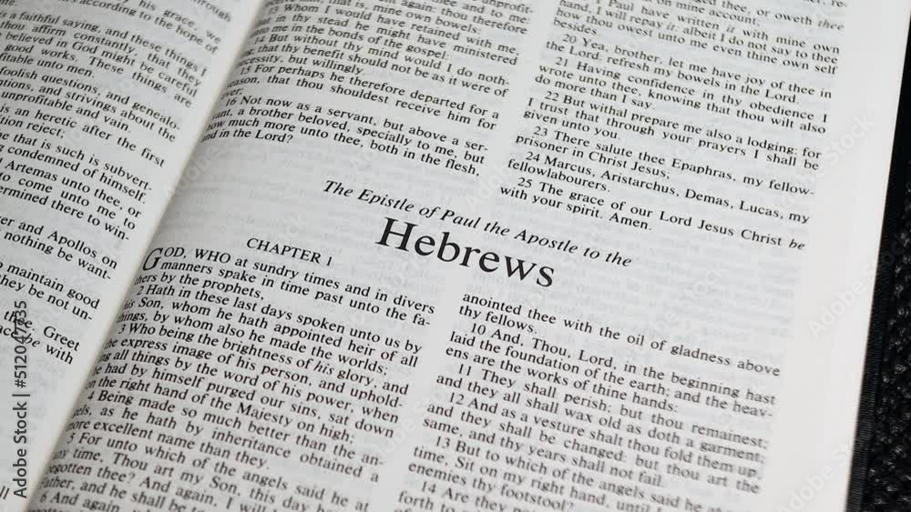 Close Up Shot of Bible Page Turning to the book of Hebrews Close Up Shot of Bible Page Turning to the book of Hebrews