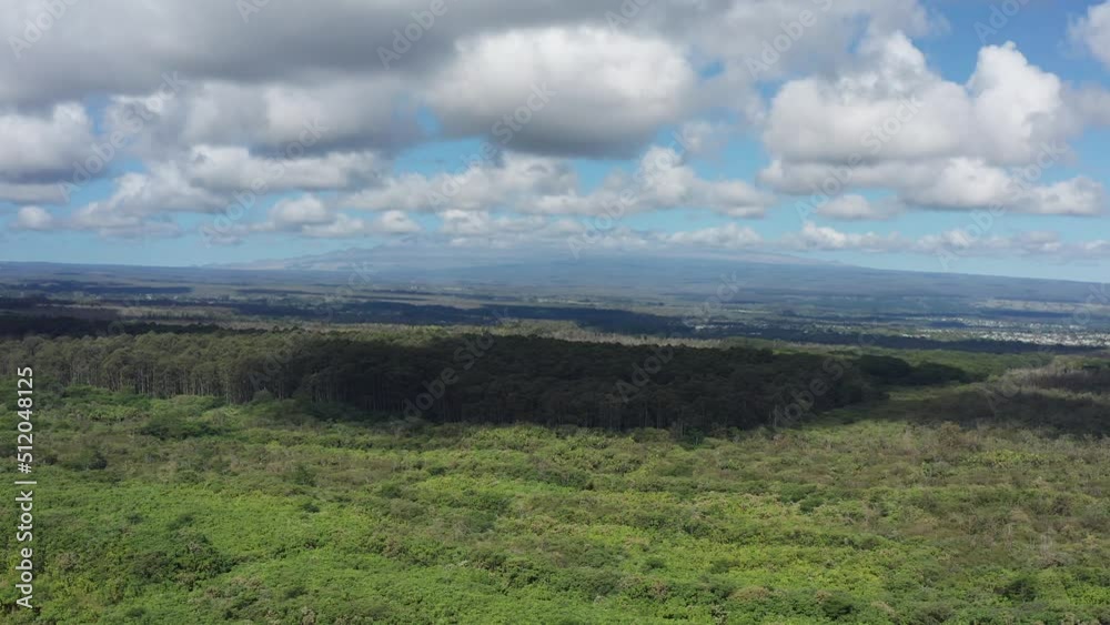 Wide rising shot of the Mauna Kea volcano with the summit obscured by clouds on the Big Island of Hawaii. 4K Wide rising shot of the Mauna Kea volcano with the summit obscured by clouds on the Big Island of Hawaii. 4K