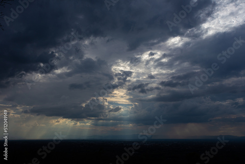 Dark storm clouds sky and thunderstorm with the rain, nature Background. Dramatic sky ray.