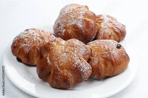 baked sweet buns on the white plate