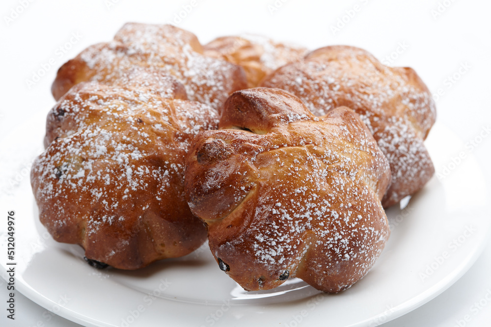 baked sweet buns on the white plate