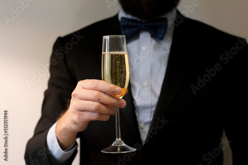 Corporate event standing young man with wineglass of champaghe